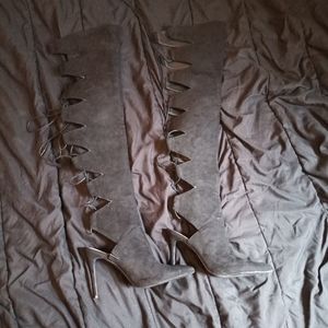 Black suede over-the-knee tie up boots heels